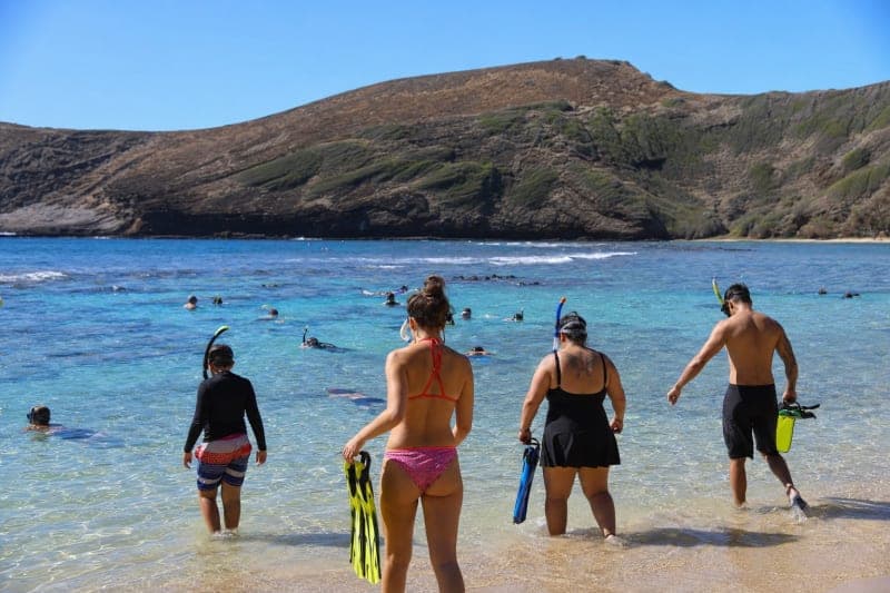 Snorkeler entering the water at Hanauma Bay